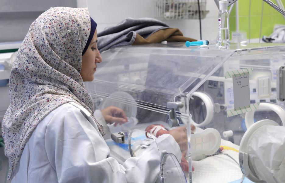 MSF nurse checking on one of the premature newborns admitted to the neonatal intensive care unit of MSF supported Nasser hospital, Khan Younis, Gaza.