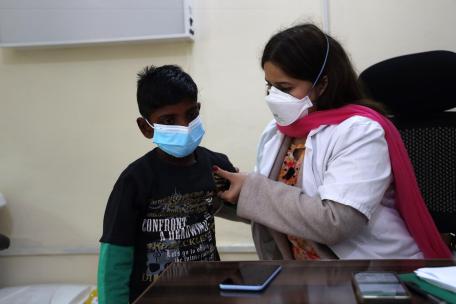Doctor Maham Khalid examines a child